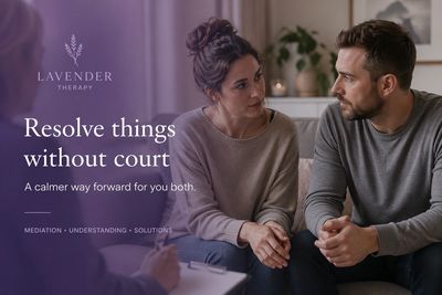 Couple having a calm, supportive conversation in a mediation-style session, focused on resolving rel