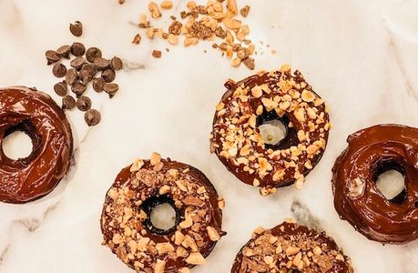 A family favorite! Baked Chocolate Donuts topped with Roasted Hazelnuts and Toffee. 