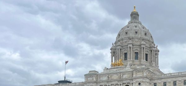 The Minnesota State Capitol building under a cloudy sky.