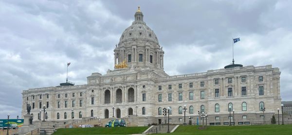 The Minnesota State Capitol building under a cloudy sky.
