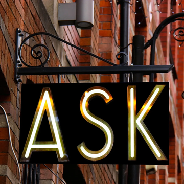 Picture of a sign reading, "Ask."