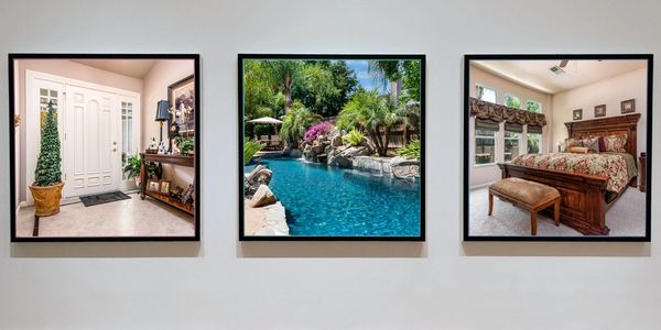 Framed pictures displayed on wall