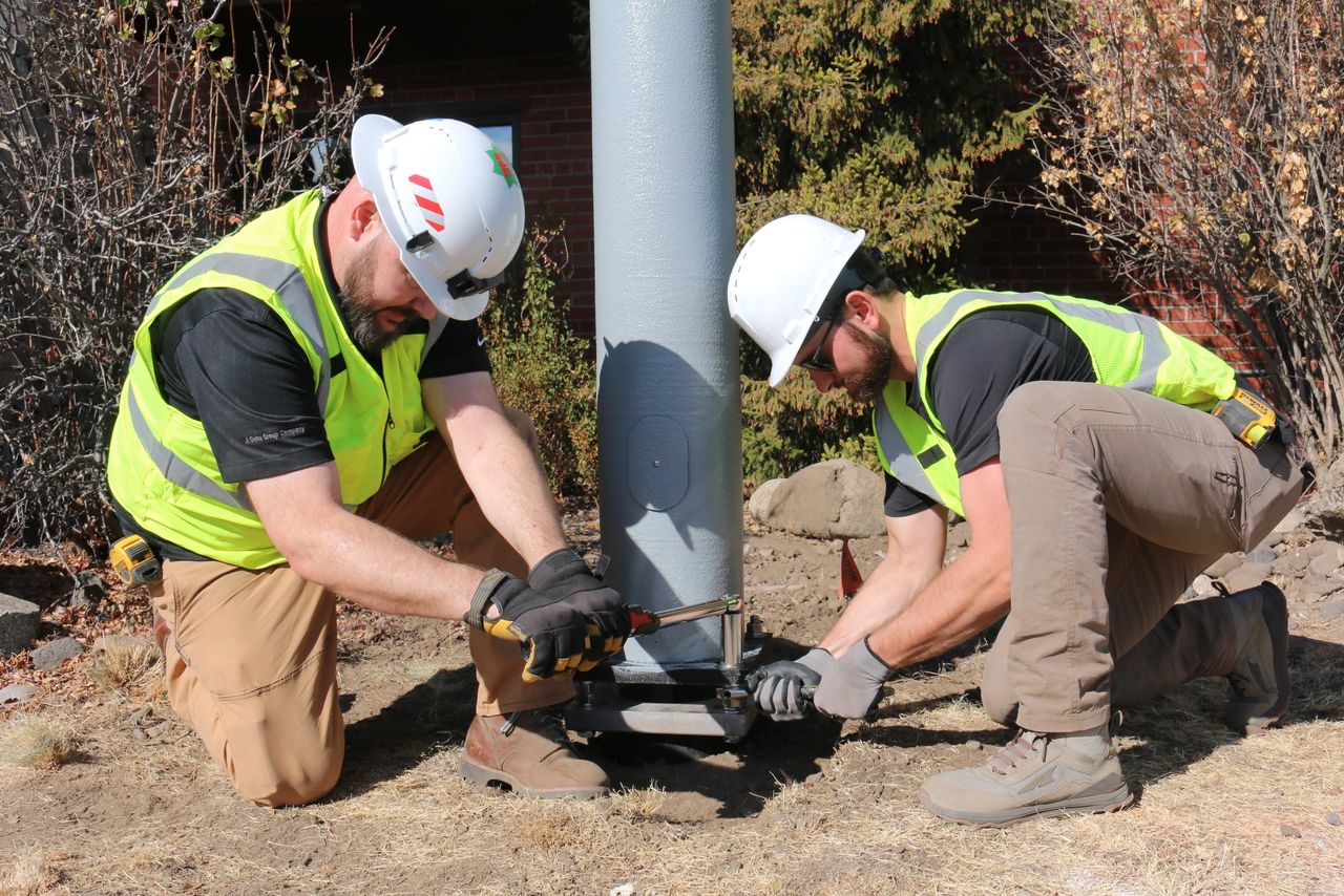 Two-man crew installs an EasyStreet composite pole