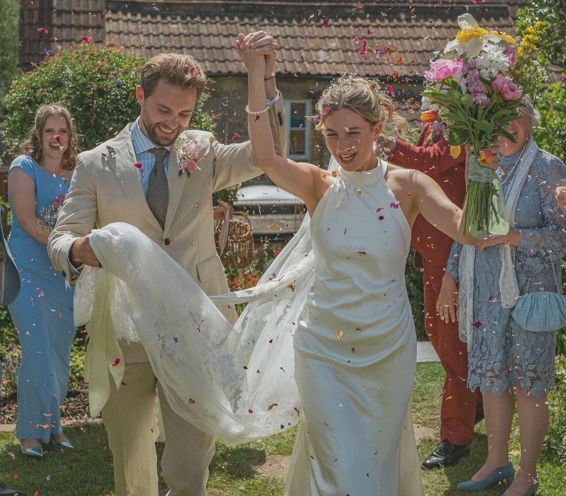 Bride and groom celebrate their wedding in the family garden, just south of Bath.
