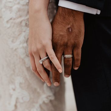 Southville celebrant. Bride and groom hold hands, showing wedding rings. 