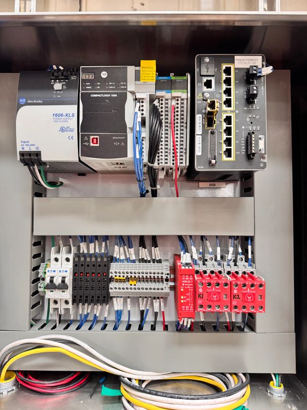 Industrial control panel with Allen-Bradley components and wiring.