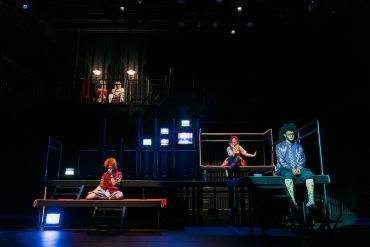 Theatrical performance with colorful lighting and costumes.