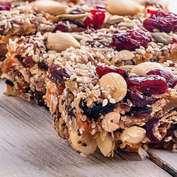 Close-up of homemade granola bars with nuts and dried fruits.