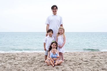 Brothers and sisters taking a beach portrait. 