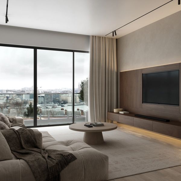 A modern and minimalist living room with a large window offering a city view.