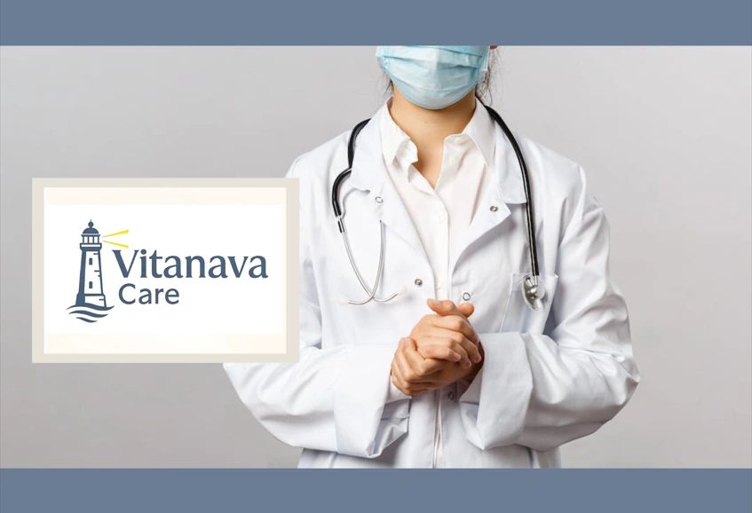 Masked healthcare professional with stethoscope and Vitanava Care logo.