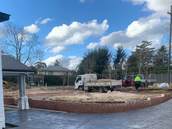 New double driveway wrap around in one and out the other with side paths back staircase