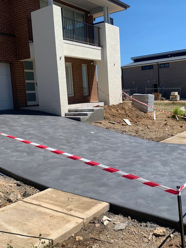 New concrete double driveway coloured , with epoxy entrance stairs 