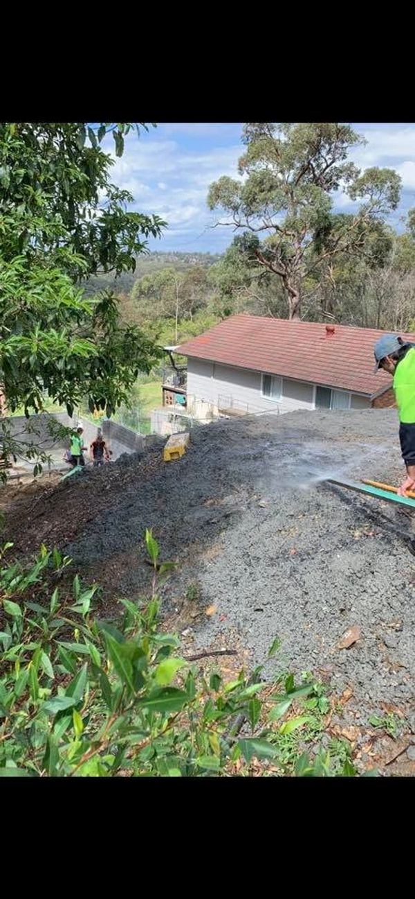Workers spreading excess concrete for a ramp to second area of pour. #nowaiste 