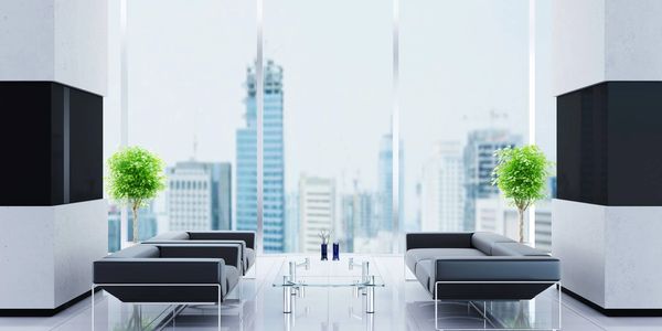 Image of clean, modern office space, with city skyline in background - Dayton, OH