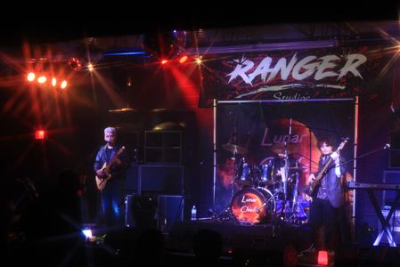 Band Lunar Chiefs performing live at Ranger Studios with vibrant stage lighting.