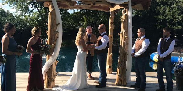 Cedar timbers give this rustic wedding arch a real vibe! Live edge wedding decor for rent or sale.