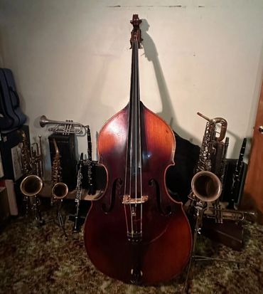 Cello and Other Musical Instruments on a Table
