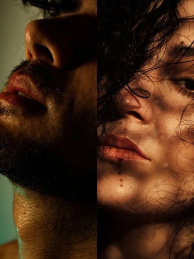 Profile of a young man and woman in the shadows.