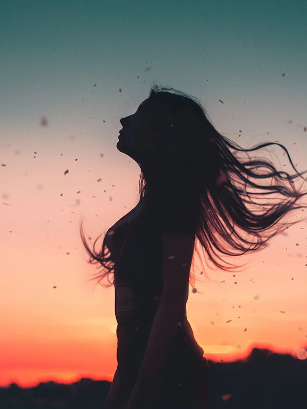 Young Woman wind blowign her hair