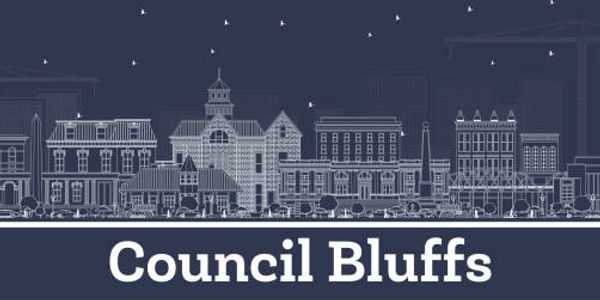 Stylized cityscape illustration with 'Council Bluffs' text below.