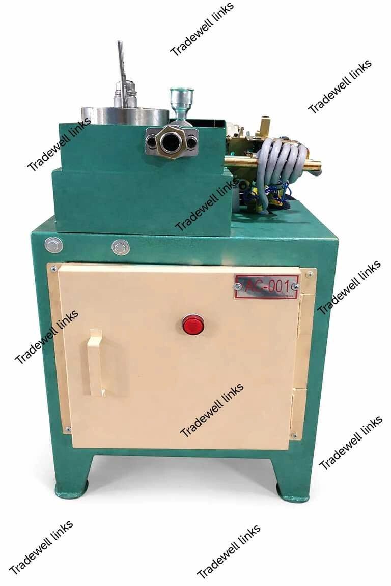 Industrial green and beige machine with control knob and pipes.
