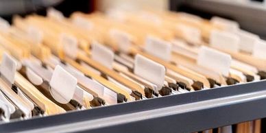 Close-up of a filing cabinet with folders.