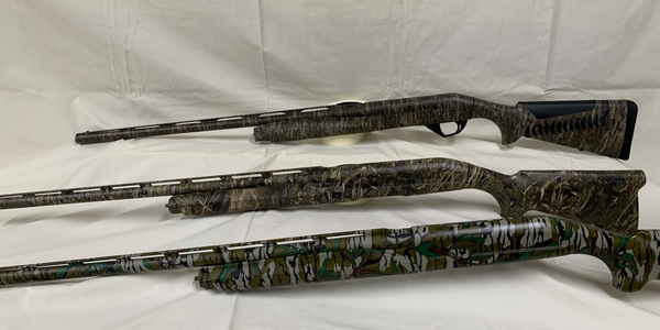 shotguns hydro dipped in mossy oak camo