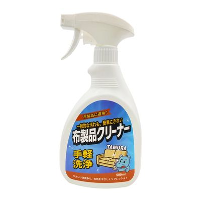 Spray cleaner bottle labeled for fabric product cleaning with Japanese text and bear illustration.