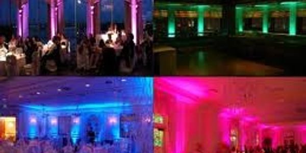Uplighting rental for wedding set in different colors at New Orleans venue.