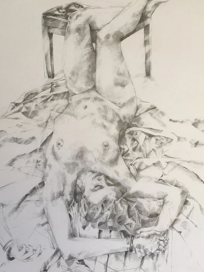 Detailed pencil sketch of a reclining nude woman with legs on a chair.