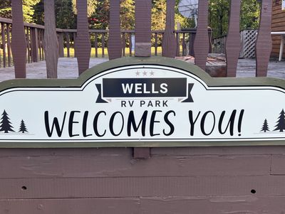 Sign welcoming visitors to Wells RV Park.