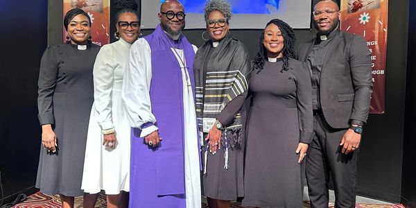 Group of clergy members posing together.