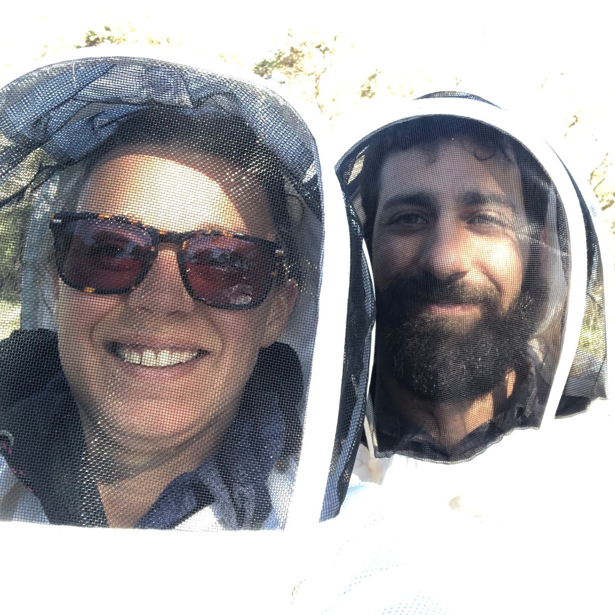 Leila and Roberto from Nectar of the Giants Honey team in their bee suit.