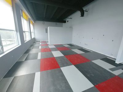 A flooring pattern with gray, white, and red colors