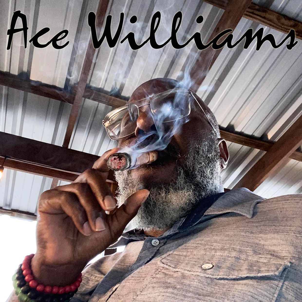 Man with glasses smoking a cigar under a metal roof with text 'Ace Williams'.