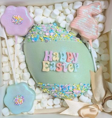 Colorful Easter-themed cookies with sprinkles and a festive ribbon.