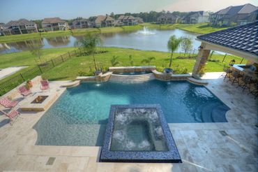 a view of a swimming pool from the top by Paragon Pools