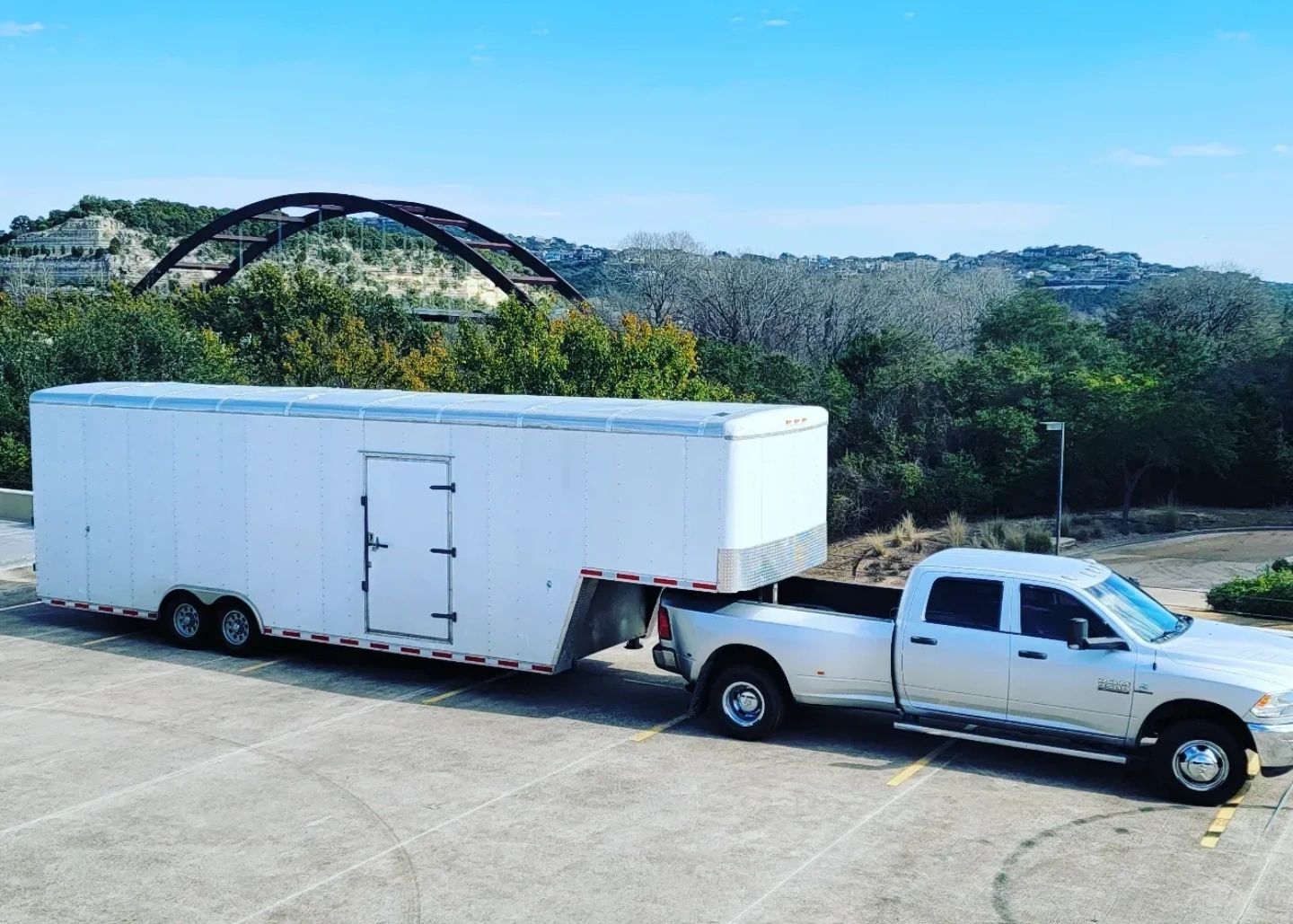 Pickup truck with trailer, used for moving furniture.