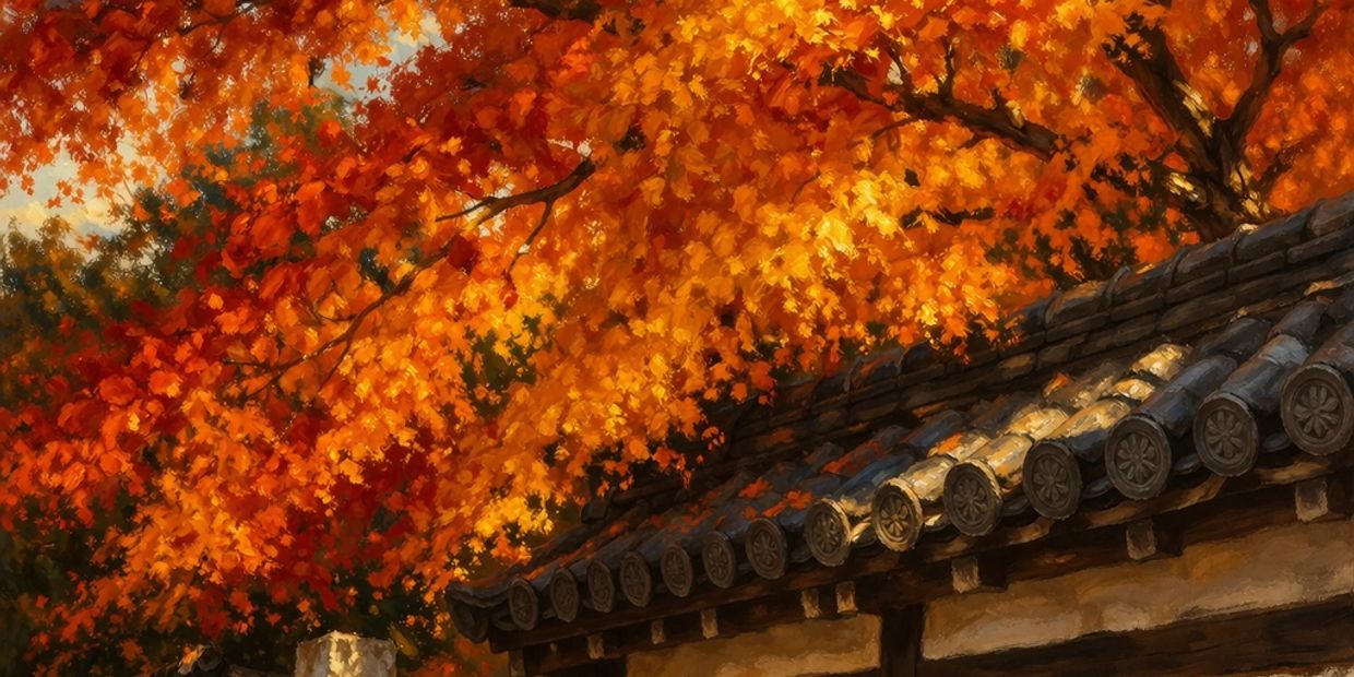 Golden autumn leaves cascade over a traditional tiled roof.