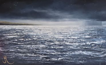 Seascape with turbulentbwaves and a stormy sky, with rain out over the sea