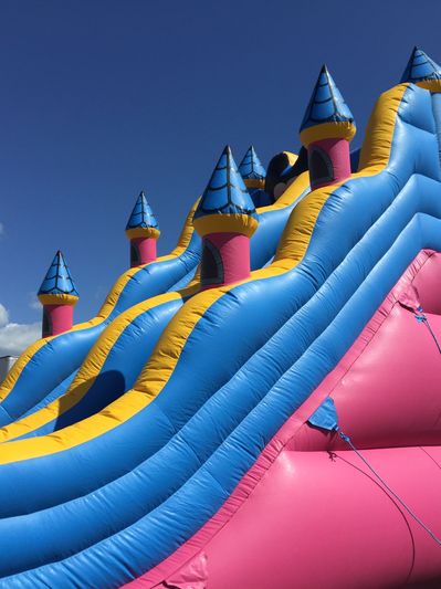 A big castle-themed inflatable slide