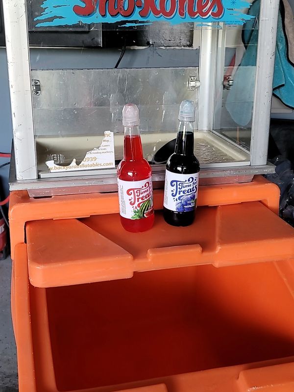 Sno kones machne along with two bottles