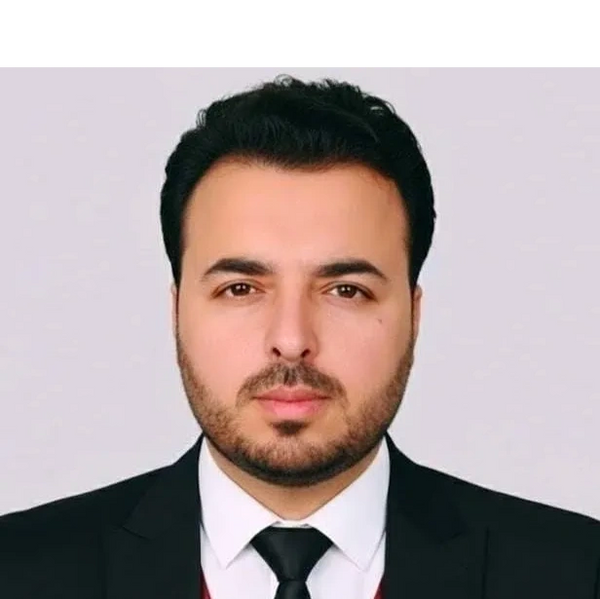 Professional man in suit and tie with a confident expression.