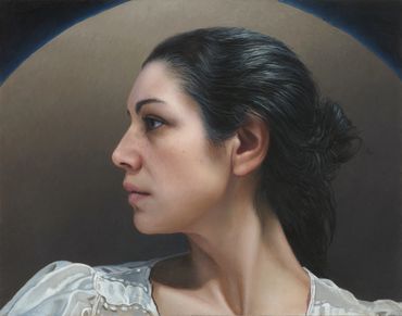 Portrait of a woman in profile with dark hair.