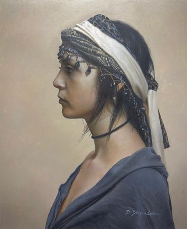 Profile of a woman with a headscarf and dark clothing.