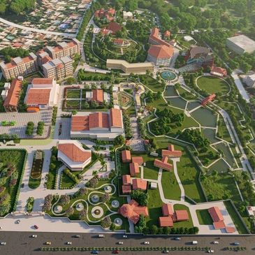 A large, green university campus with multiple buildings and pathways.