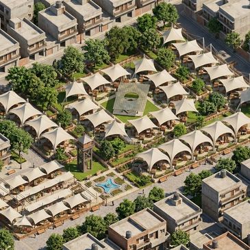 Aerial view of a modern residential complex with tents and greenery.