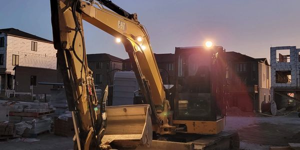 Mini excavator on job site