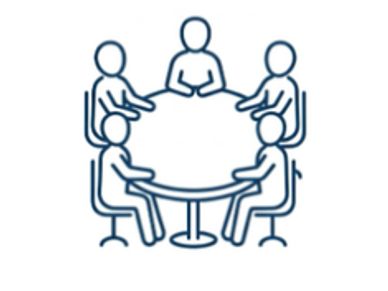 Five people sitting around a round table having a discussion.